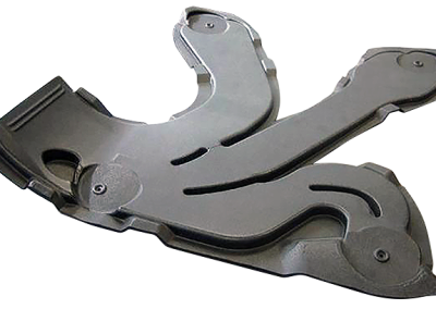 Gray molded plastic duct or panel assembly with three branching curved arms and visible fasteners. One end has a black rectangular section with a round opening.